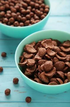 Set of various breakfast cereals on blue background. Vertical photo Stock Photos