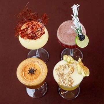 Set of various cocktails on dark background. Colorful cocktail decorated Fotos de archivo
