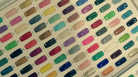 A set of various colors of the false nails on the store showcase Stock Footage 68371456