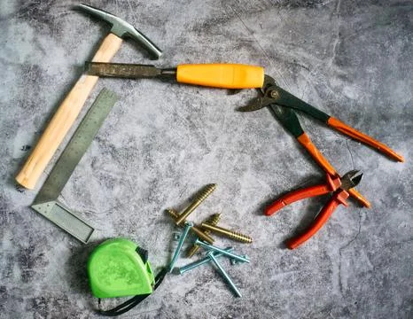 Set of various construction tools on a stone floor . Tools for home repair... Stock Photos