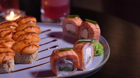 Set of various delicious appetizing sushi rolls table with cocktail, soy sauce, Stock Footage 269544506