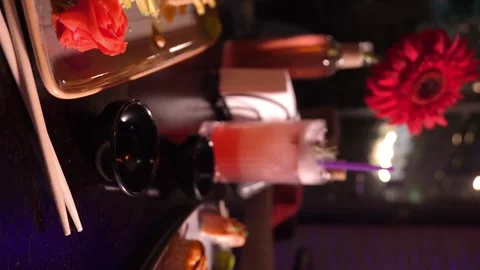 Set of various delicious appetizing sushi rolls on table with cocktail, 스톡 동영상 269561996