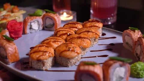 Set of various delicious appetizing sushi rolls table with cocktail, soy sauce, Stock Footage 269571430