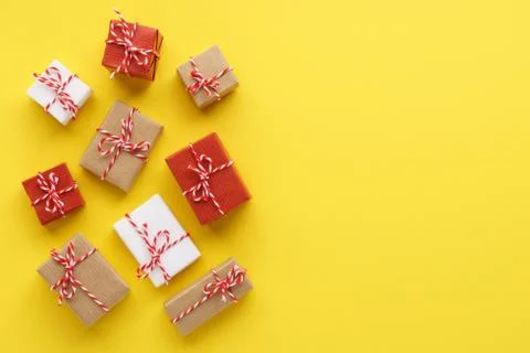 Set of various gift boxes on yellow background. Flat lay. Stock Photos