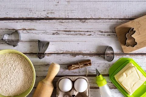 A set of various ingredients for baking - flour, eggs, cinnamon, butter, kitc Stock Photos