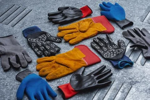 Set of various protective work gloves in different colors and materials pla.. Stock Photos