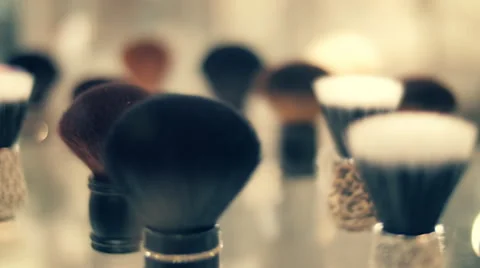 A set of various size and different color brushes for powder in the store Stock Footage 68372200