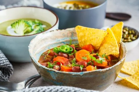 Set of vegan soups. Mexican bean soup, broccoli cream soup and mashed pumpkin Stock Photos