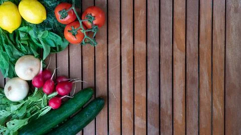Set of vegetables and greens on the side flat background on the tree Stock Photos