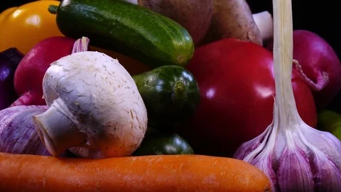 Set of vegetables close up, rotating contra clockwise on black background Stock-Footage 78355107