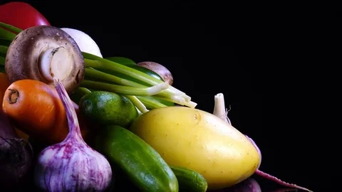 Set of vegetables rotating contra clockwise on black background with side center Stock Footage 78348455