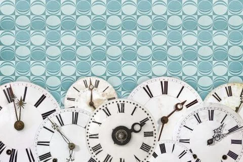 Set of vintage clock faces against a retro wallpaper background Stock Illustration