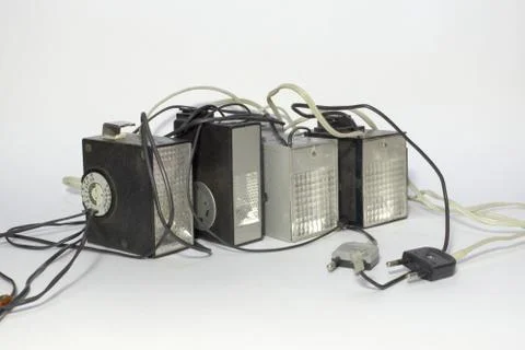 Set of vintage electronic pulse camera flash with hot shoe Stock Photos