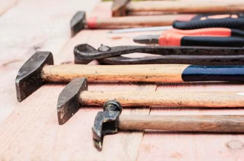 Set of vintage hand construction tools on a wooden background. Stock Photos