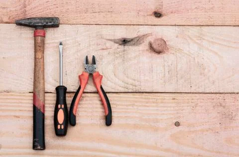 Set of vintage hand construction tools on a wooden background. Stock Photos
