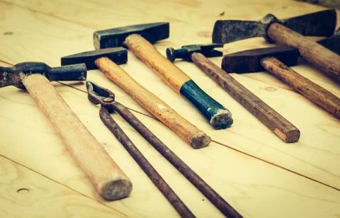 Set of vintage hand construction tools on a wooden background retro concept Stock Photos
