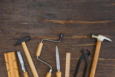 A set of vintage instruments on a dark rough wooden background. Horizontal with Stock Photos