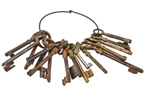 Set of vintage rusty keys on a ring isolated on white Stock Photos