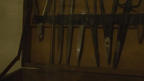 A set of vintage surgical instruments displayed in a wooden box 스톡 동영상 301153837