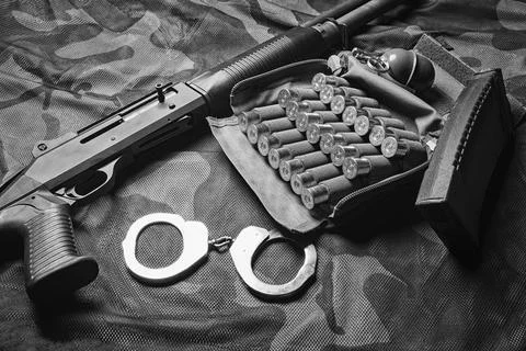 Set of weapons of a fighter of a special unit. Shotgun, ammo, grenade and h.. Stock Photos