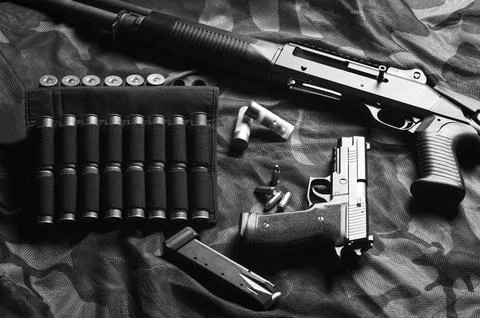 Set of weapons of a fighter of a special unit. Shotgun, cartridges, gun. To.. Stock Photos