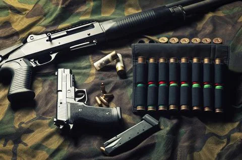 Set of weapons of a fighter of a special unit. Shotgun, cartridges, gun. To.. Stock Photos
