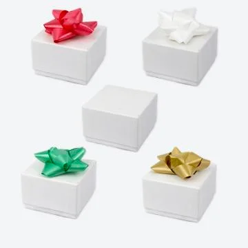 Set of white cardboxes with a bow on top. Stock Photos