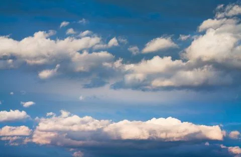 Set of white clouds over blue Stock Photos