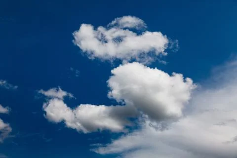 Set of white clouds over blue Stock Photos