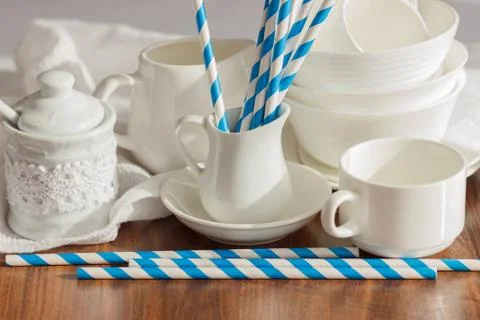 Set of white empty tableware with striped tubules 库存照片
