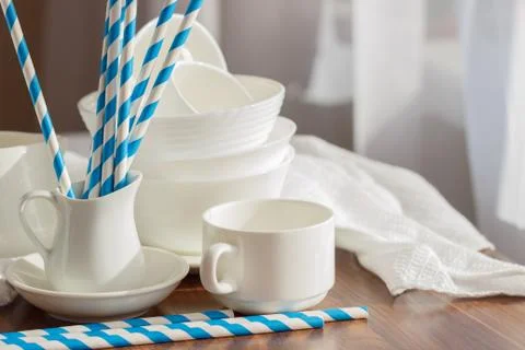 Set of white empty tableware with striped tubules Stock Photos