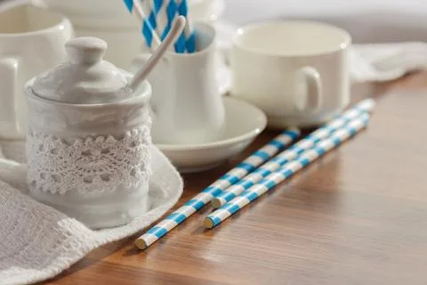 Set of white empty tableware with striped tubules Stockfoto's