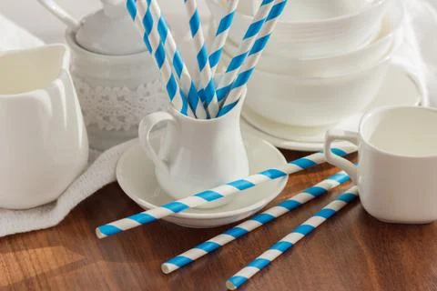 Set of white empty tableware with striped tubules Foto stock