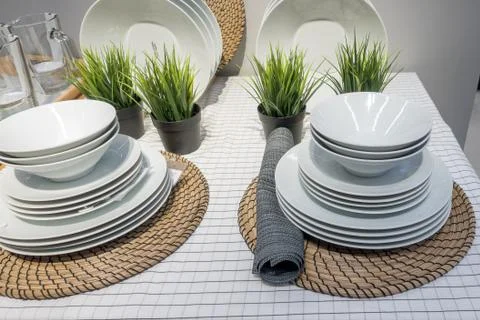 A set of white plates on table Stock Photos