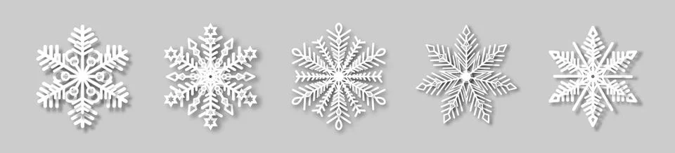 A set of white snowflakes with a paper effect and a shadow on a gray background. Stock Illustration