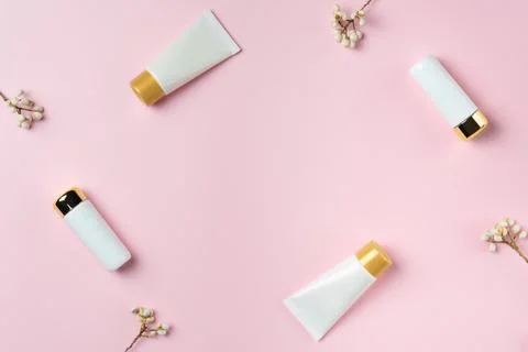 Set of white tubes on a pink background, top view Stock Photos