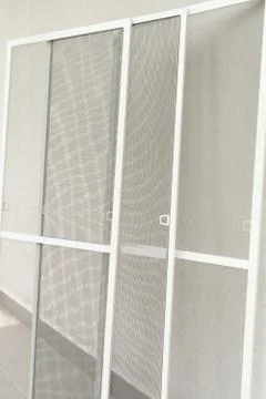 Set of window mosquito nets, close up view. Reliable protection against mosqu Stock Photos