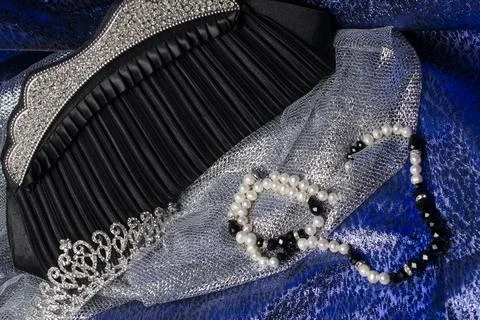 Set of women's accessories on a silk background Stock Photos