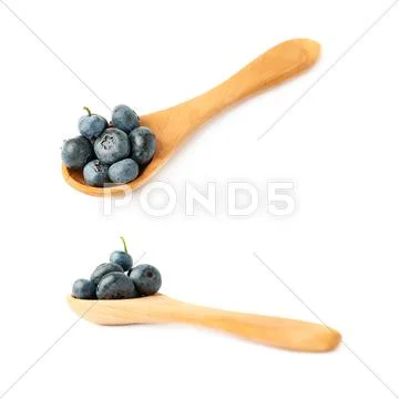 Set of Wooden spoon filled of Bilberry or blueberry over isolated white Stock Photos
