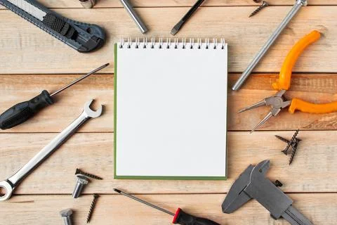 Set of work tools on a wooden background. Festive greeting card concept for.. Stock Photos