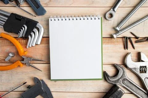 Set of work tools on a wooden background. Festive greeting card concept for.. Stock Photos