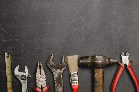 Set of working tools on black background Stock Photos