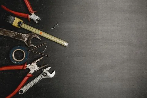 Set of working tools on black background Stock Photos