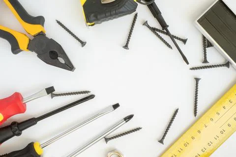 A set of working tools on a white background. Hardware store. Close-up. Const Stock Photos