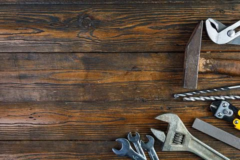 Set of working tools on wooden rustic background. Top view. Copy space Stock Photos