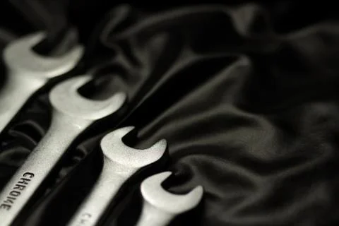 Set of wrenches on black background Stock Photos