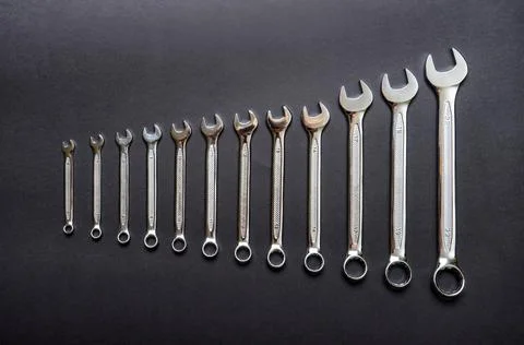 Set of wrenches on black background. Tools spanners. Technique repair, equipm Stock Photos