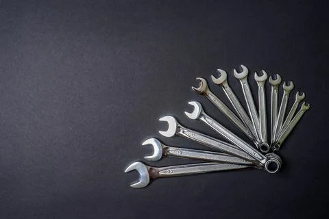 Set of wrenches on black background. Tools spanners. Technique repair, equipm Stock Photos