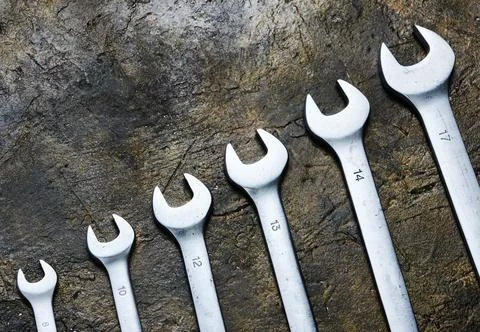 Set of wrenches on a concrete background. Stock Photos