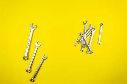 Set of wrenches of different sizes on a yellow background Stock Photos